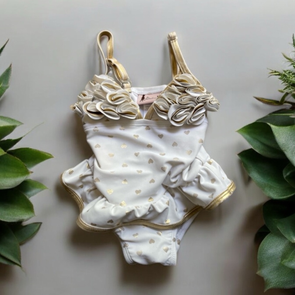 12 month one piece swimsuit. Tight. No buttons. Ruffles/gold hearts.
